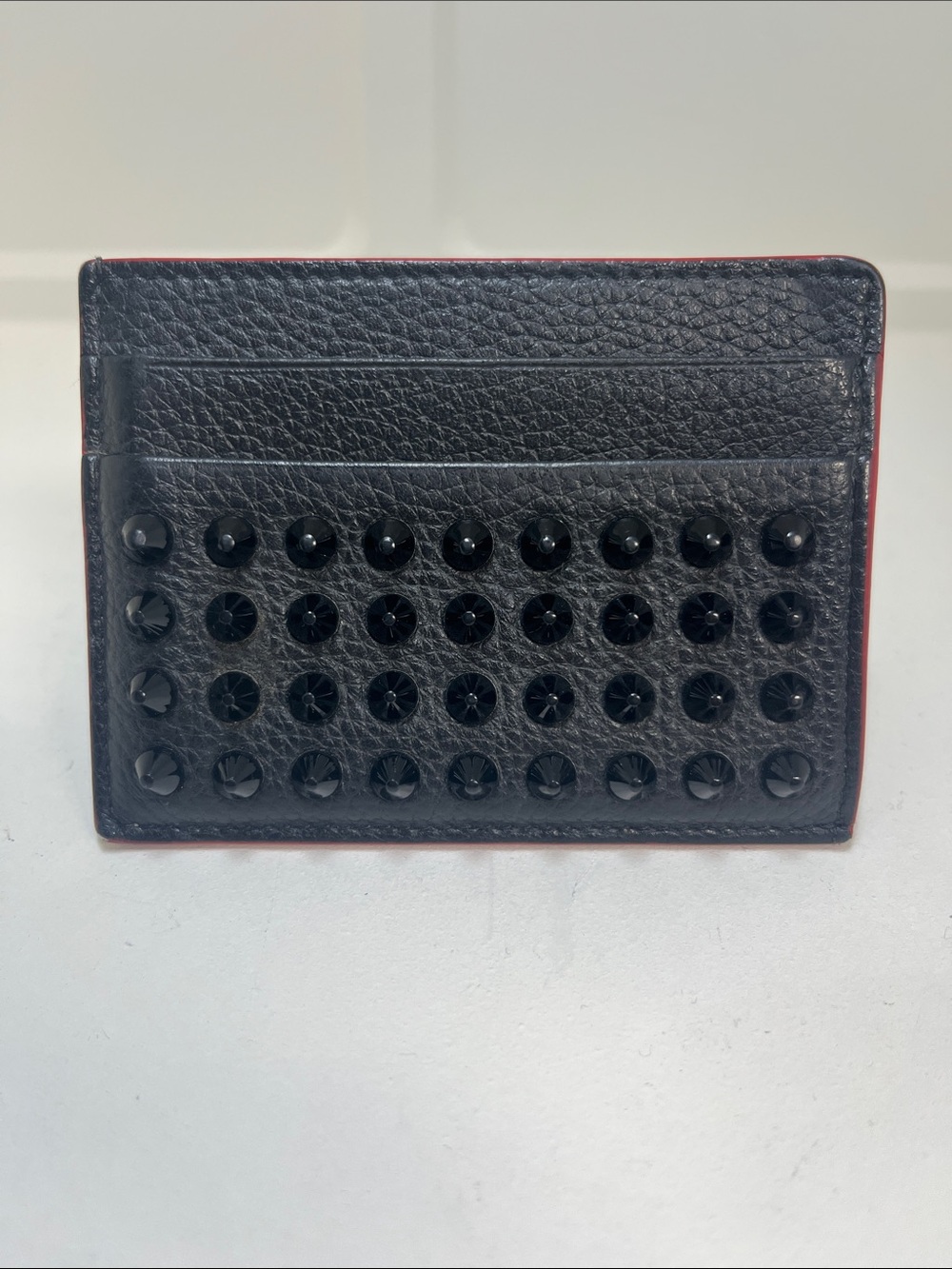 Christian Louboutin Black Leather Studded Card Holder with Red Trim. Chic trendy
